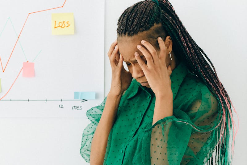 a woman frustrated over profit loss